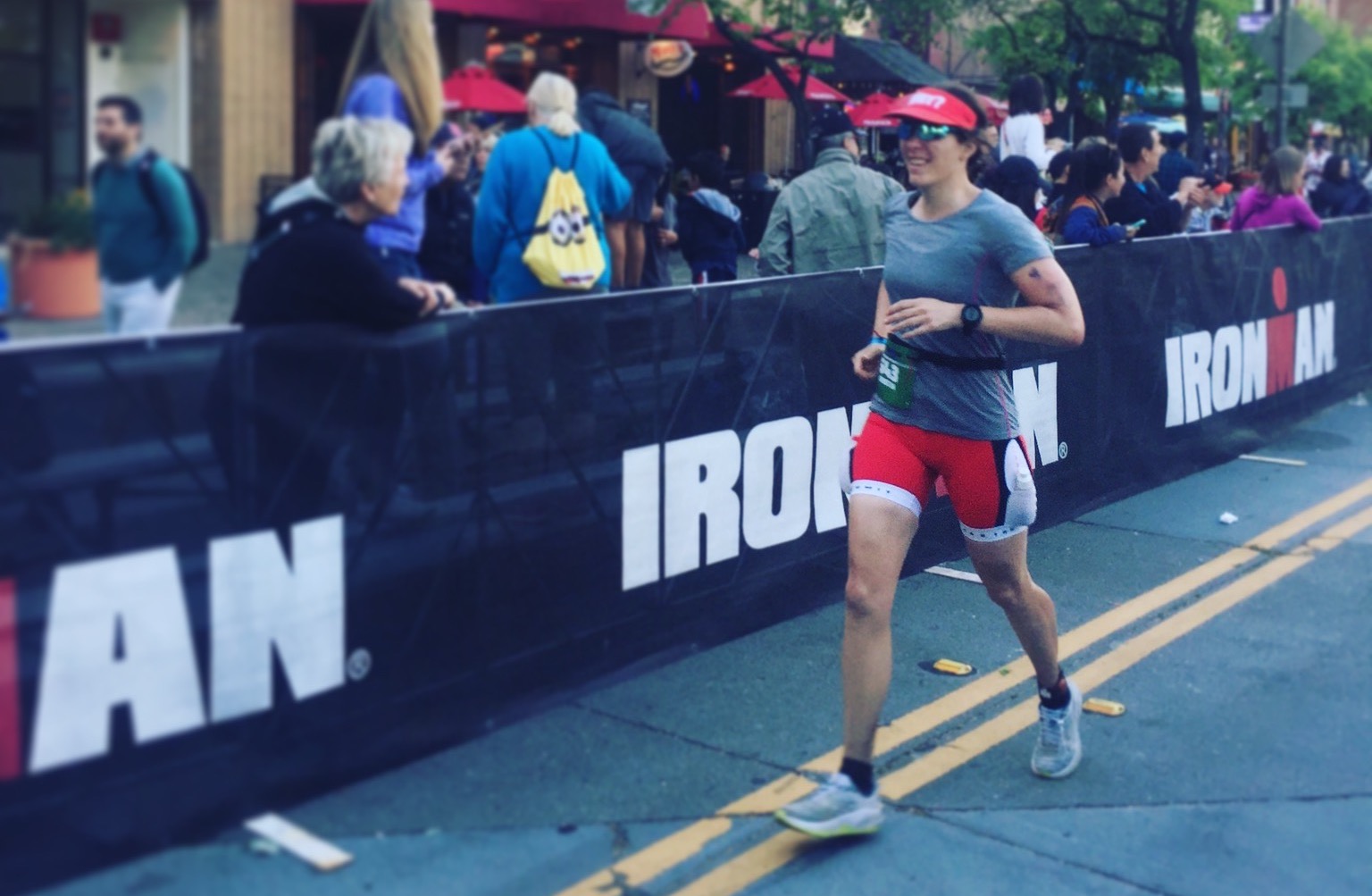 a person running to the finish of Ironman Santa Rosa
